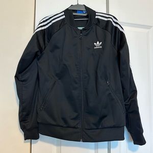 Adidas track suit. Pants are leggings close fit.